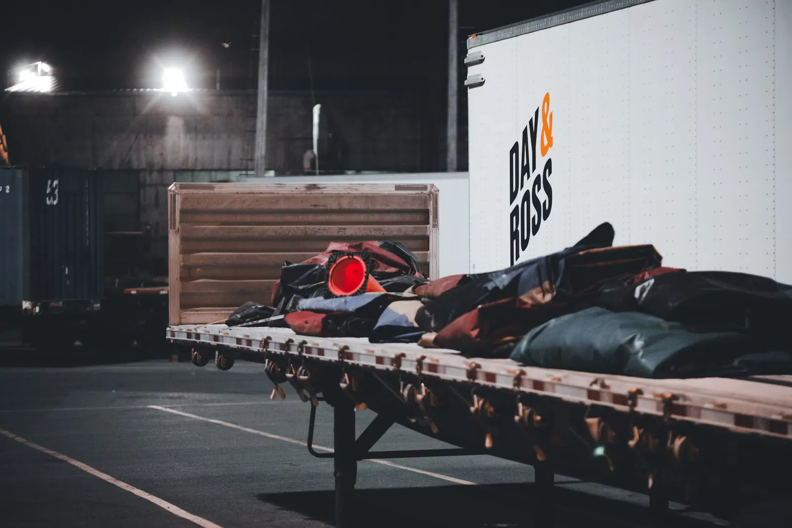 Commercial truck in a freight yard at night